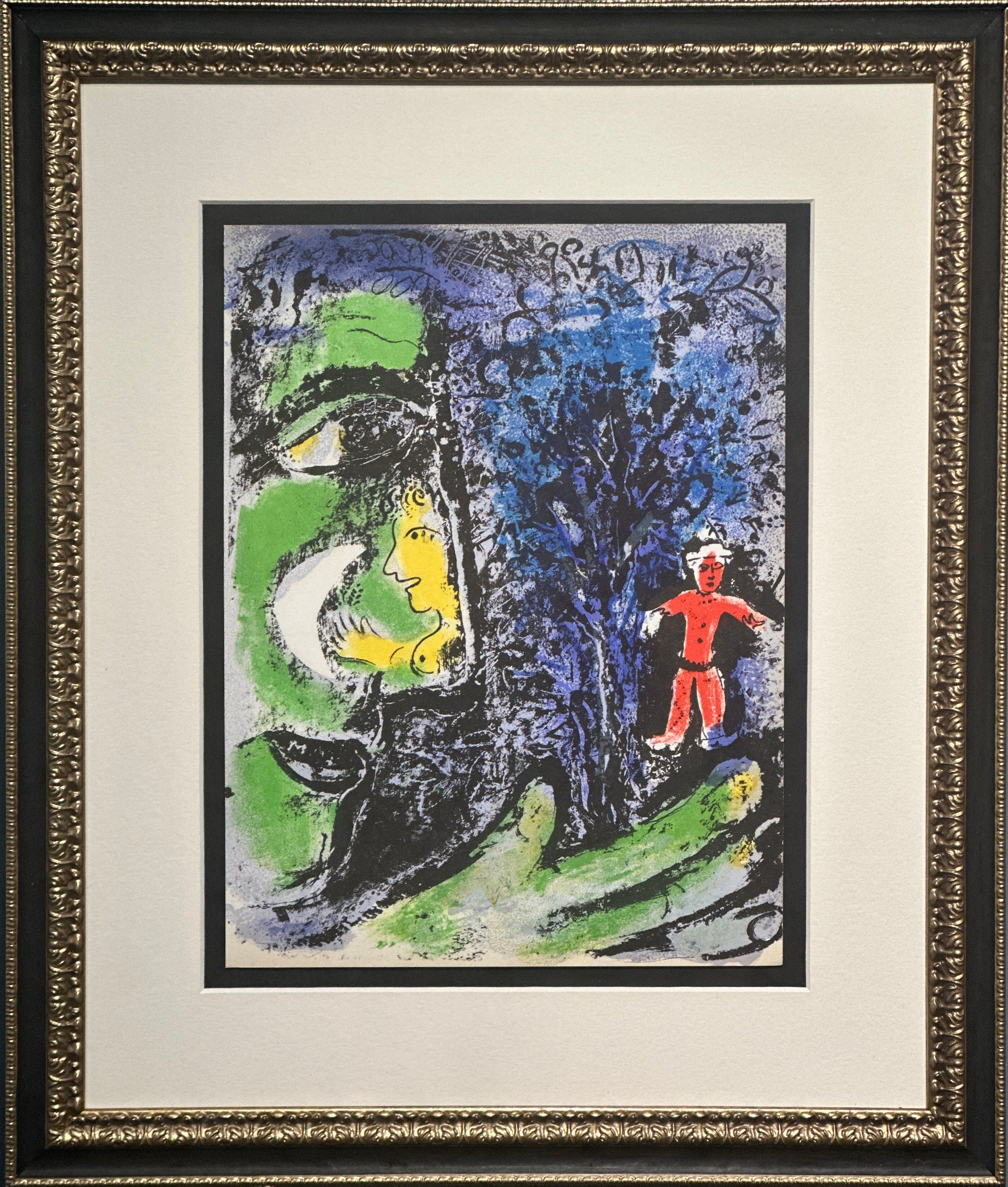 Framed abstract art print featuring a large green and black face on the left, a blue textured background on the right, and a small red figure near the lower right. The print is matted with white and enclosed in an ornate gold and black frame.