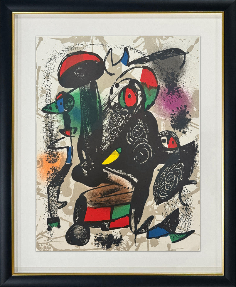 A framed abstract art print featuring bold black, red, green, blue, yellow, and orange shapes on a textured off-white background, enclosed in a white mat and a black frame with a gold inner trim.