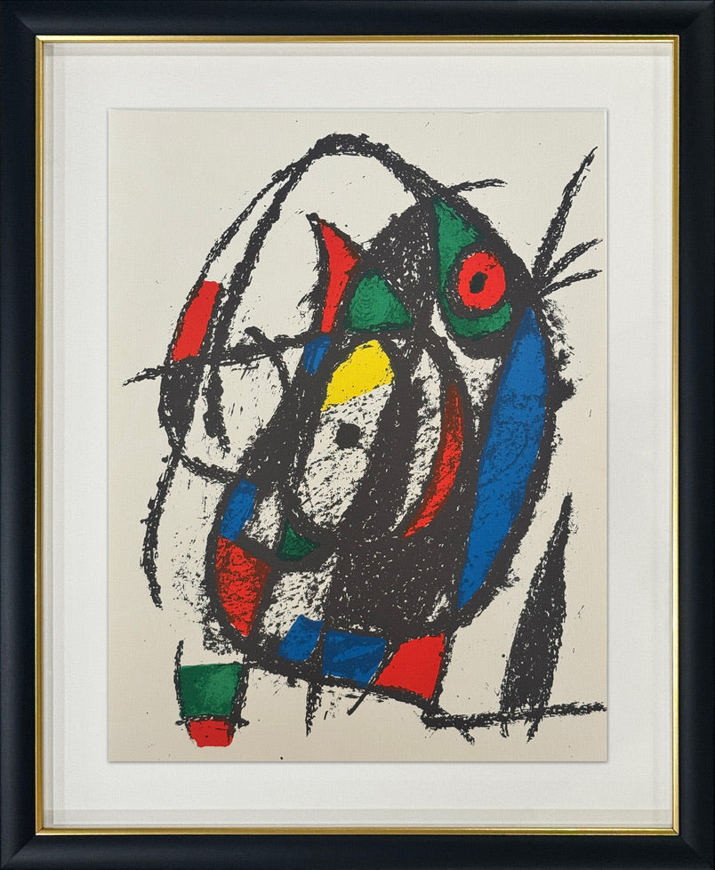 Framed abstract expressionist painting featuring a stylized face with bold black, blue, red, green, and yellow shapes on a cream background, enclosed in a white mat and black frame with a gold inner trim.